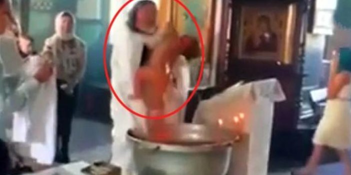 Papaz, vaftiz töreninde suya girmeye direnen bebeğe işkence yaptı!