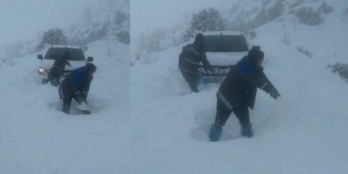 Artvin'de karda kalan araçlarını baretleri ile çıkardılar