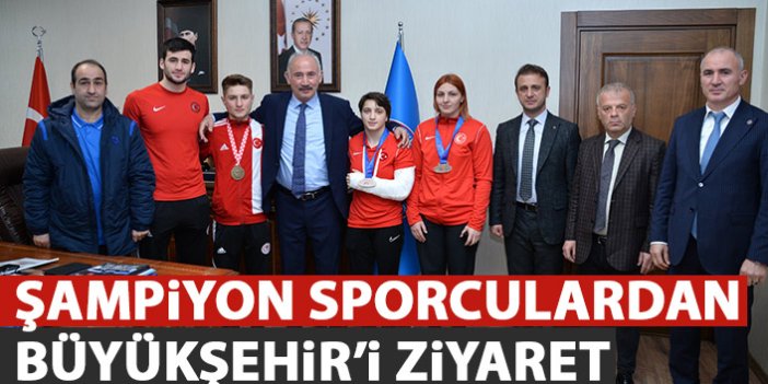 Şampiyon sporcular Büyükşehir'i ziyaret etti